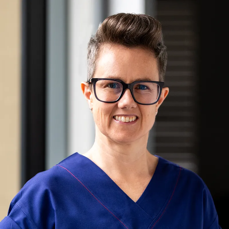 Dr Belinda Holmes portrait in medical scrubs